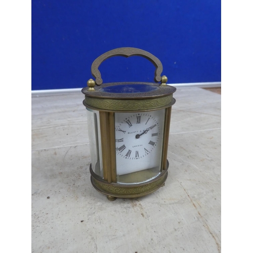 690 - A stunning miniature Ellliott & Son, London carriage clock, with decorative brass case and ceramic f... 