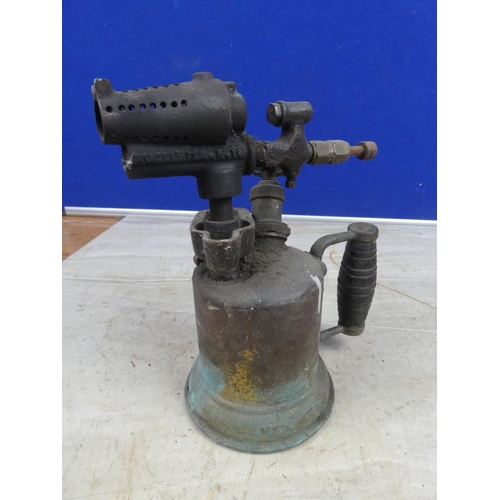 691 - An antique brass blow torch with wooden handle.