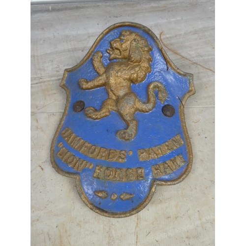 692 - An antique 'Bamfords Patent Lion Horse Rake' cast iron plaque.  Approx 20x24cm.