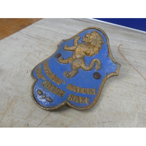 692 - An antique 'Bamfords Patent Lion Horse Rake' cast iron plaque.  Approx 20x24cm.