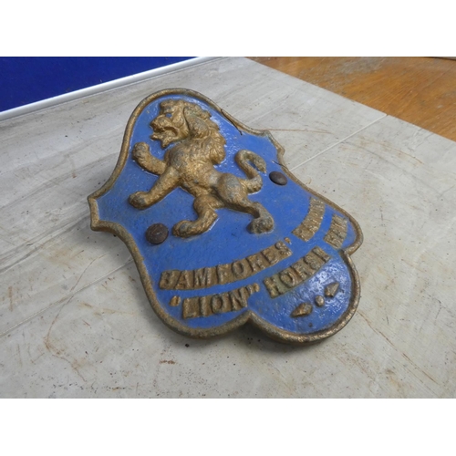 692 - An antique 'Bamfords Patent Lion Horse Rake' cast iron plaque.  Approx 20x24cm.