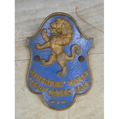 692 - An antique 'Bamfords Patent Lion Horse Rake' cast iron plaque.  Approx 20x24cm.