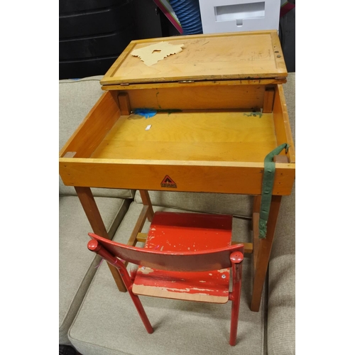 1198 - A vintage Triang child's desk and red painted chair.  Approx 53x60x40cm.