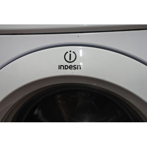 1211 - An Indesit tumble dryer.