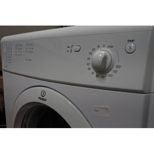 1211 - An Indesit tumble dryer.