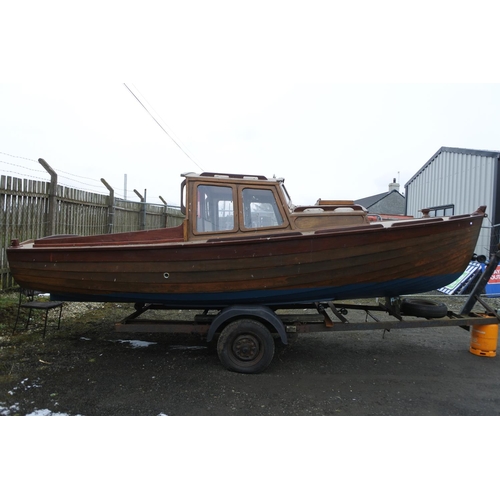 1212 - A stunning 19ft clinker fishing boat with cabin and boat trailer.