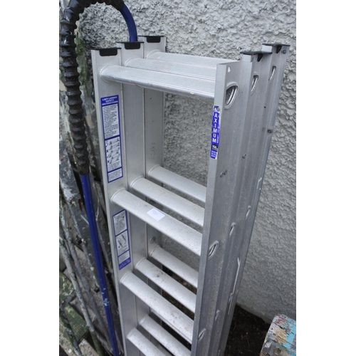 1230 - A metal extending ladder.