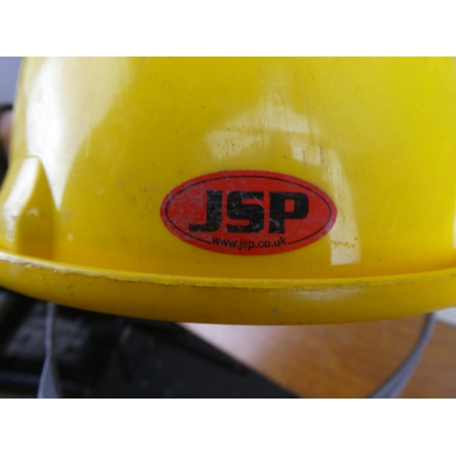 1117 - Three JSP hard hats.