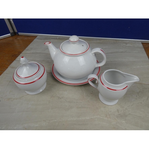 1120 - A German pottery teapot, milk jug, sugar bowl and plate.