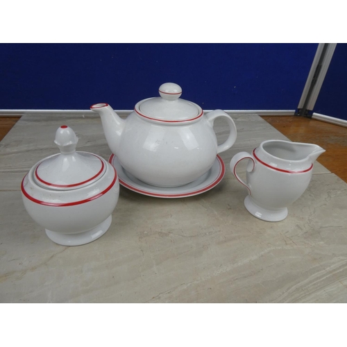 1120 - A German pottery teapot, milk jug, sugar bowl and plate.