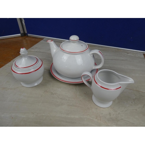 1120 - A German pottery teapot, milk jug, sugar bowl and plate.