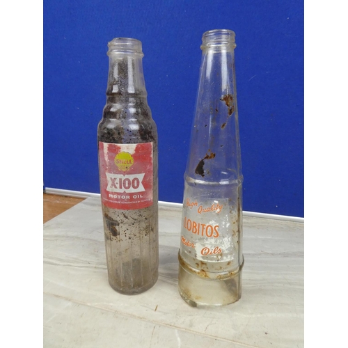 1128 - A vintage Shell X100 motor oil bottle (a/f) and a vintage Lobitos motor oil bottle.