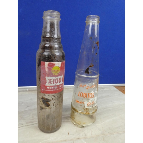 1128 - A vintage Shell X100 motor oil bottle (a/f) and a vintage Lobitos motor oil bottle.