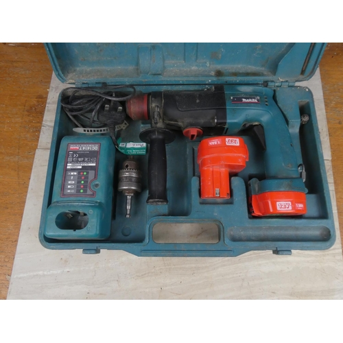 1169 - A cased Makita drill, battery charger and more.