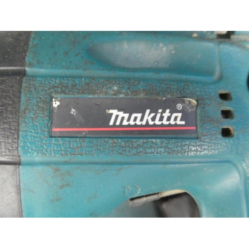 1169 - A cased Makita drill, battery charger and more.