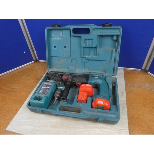 1169 - A cased Makita drill, battery charger and more.