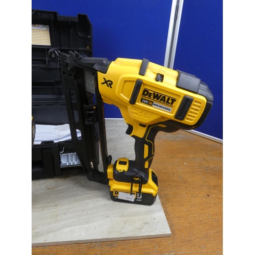 1179 - A Dewalt nail gun, screwdriver, battery and charger in case.