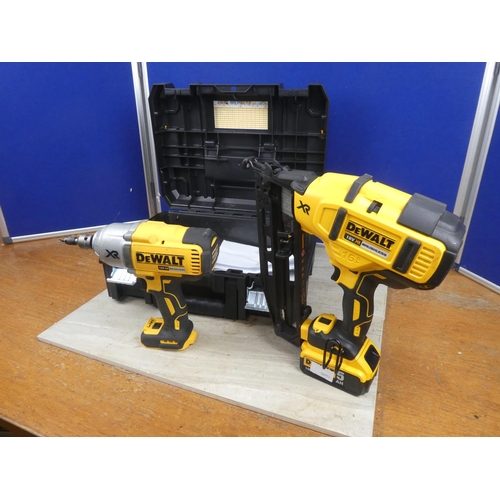 1179 - A Dewalt nail gun, screwdriver, battery and charger in case.