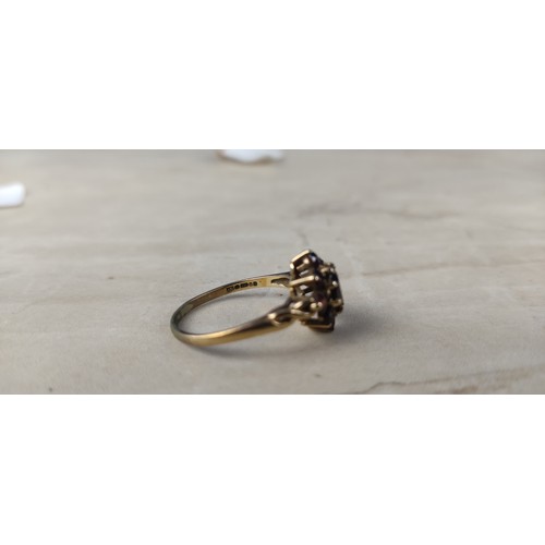 1002 - A stunning antique gold and garnet dress ring.