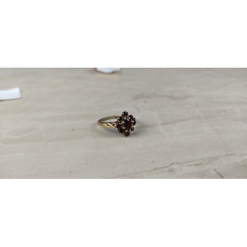 1002 - A stunning antique gold and garnet dress ring.