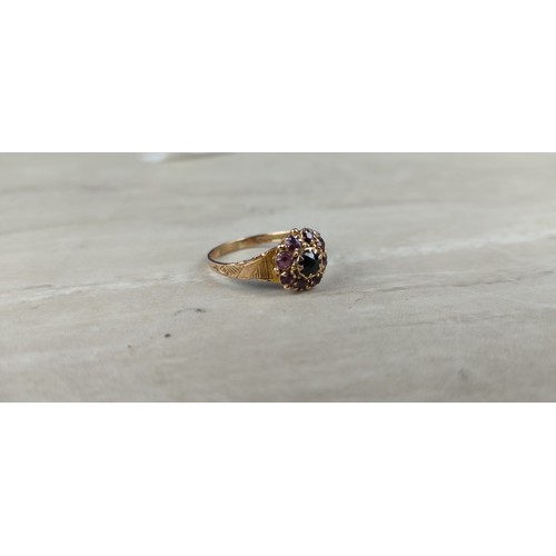 1003 - A stunning antique gold and amethyst dress ring.