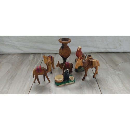 1084 - A collection of wooden animal figures and more.