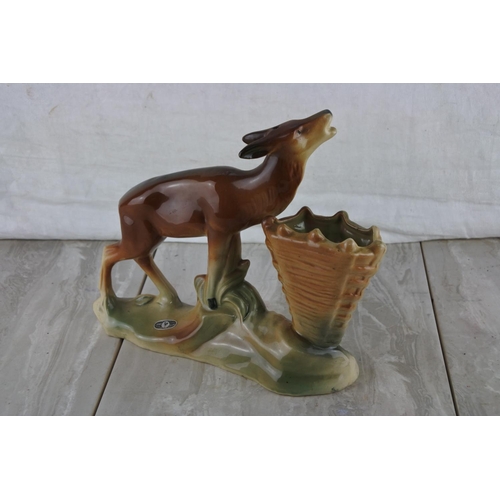 69 - A vintage Jema pottery figure of a deer and vase.  Approx 24cm.
