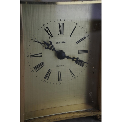 336 - A vintage battery powered Estyma carriage clock.