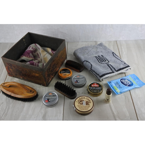 10 - A vintage Inglis biscuit tin containing assortment of shoe polish, brushes and more.