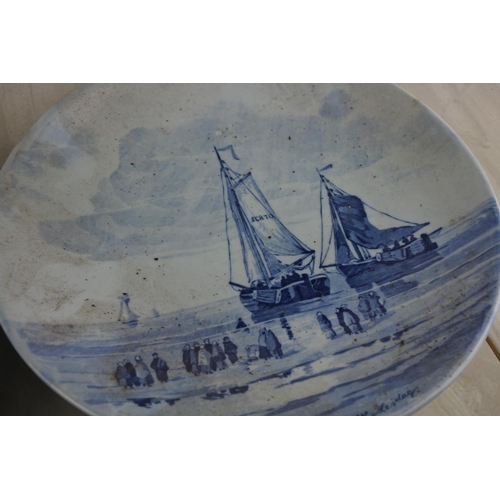 13 - Two stunning antique blue white delft plates with decorative scenes, each signed to rear. Approx 29c... 