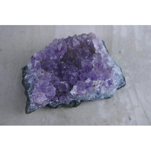 36 - A small amethyst crystal.