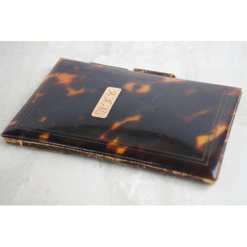 41 - A stunning antique tortoise shell card case with rose gold mount 'W.G.C'.