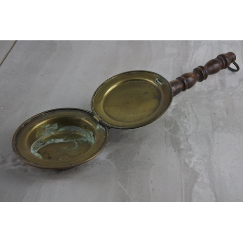 50 - An antique miniature brass bed warmer with wooden turned handle.