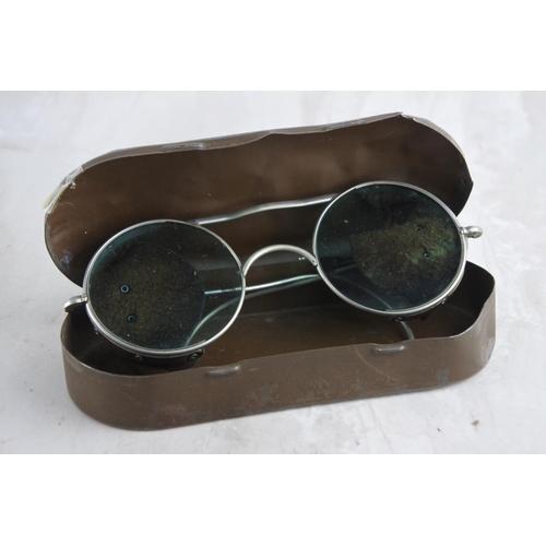 A cased pair of WW2 RAF pilot sunglasses.