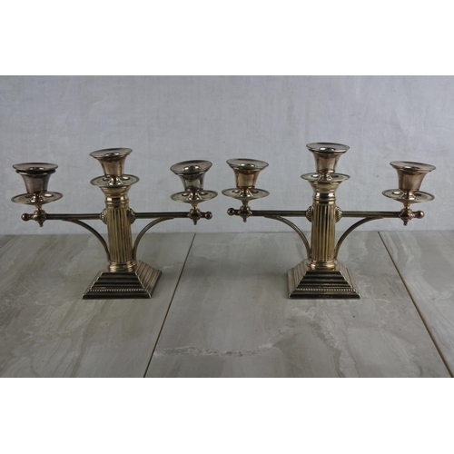 63 - A stunning pair of silver plated, Corinthian column three branch candlesticks. Approx 18x26cm.