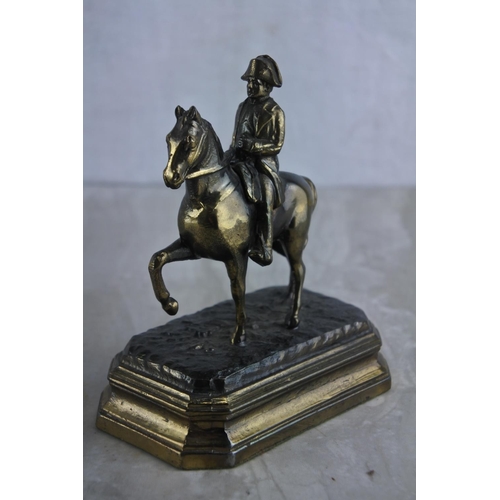 64 - A vintage metal figure, modelled as Napoleon on horse, embossed G.R. France. Approx 12cm.