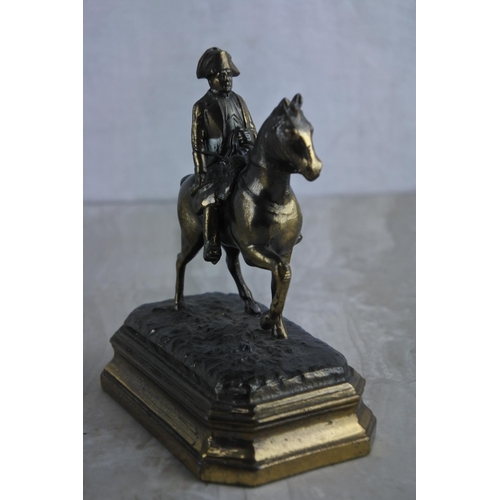 64 - A vintage metal figure, modelled as Napoleon on horse, embossed G.R. France. Approx 12cm.