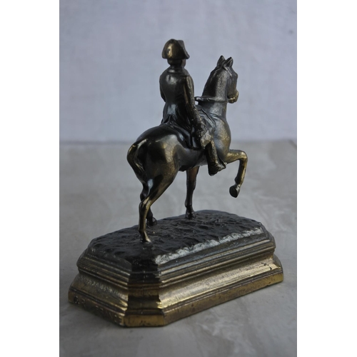 64 - A vintage metal figure, modelled as Napoleon on horse, embossed G.R. France. Approx 12cm.