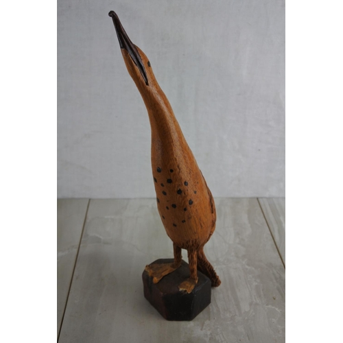 69 - A wooden hand carved figure of a bird, by local Artist, Bobby Fisher. Approx 37cm.