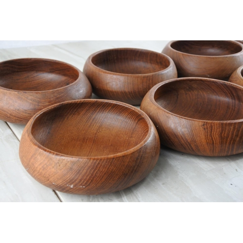 77 - Eight vintage teak bowls.