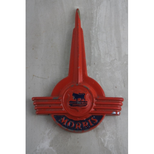 82 - A vintage Morris Minor hood badge. Approx 17x11cm.