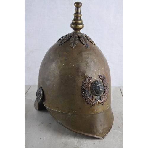 A stunning antique French fireman's helmet.