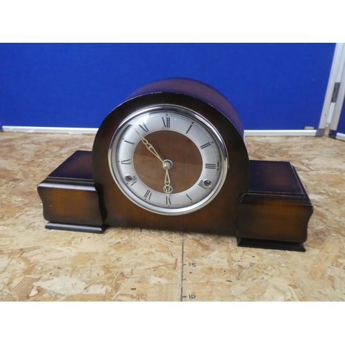 628 - A Westminster chiming clock with key.  Approx 45x28x12cm.