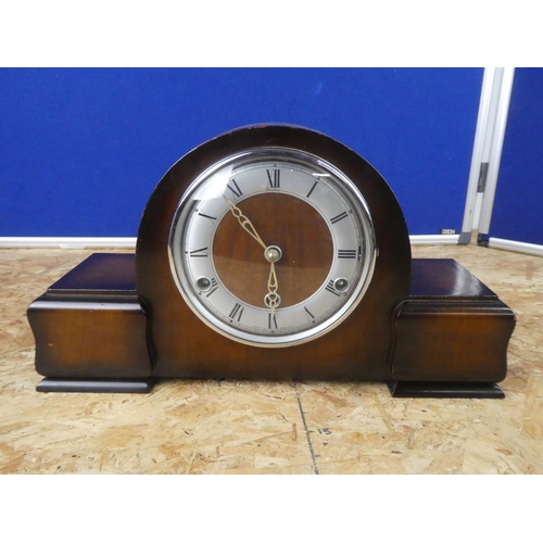 628 - A Westminster chiming clock with key.  Approx 45x28x12cm.