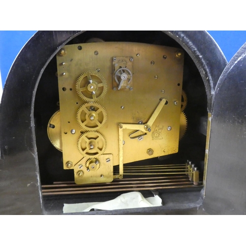 628 - A Westminster chiming clock with key.  Approx 45x28x12cm.