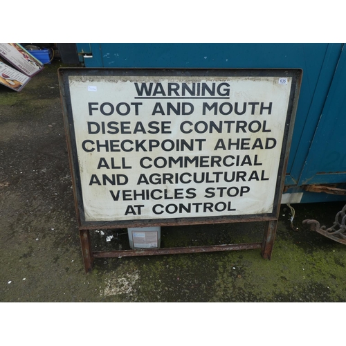 635 - A large warning road sign 'Foot and Mouth Disease Control'.