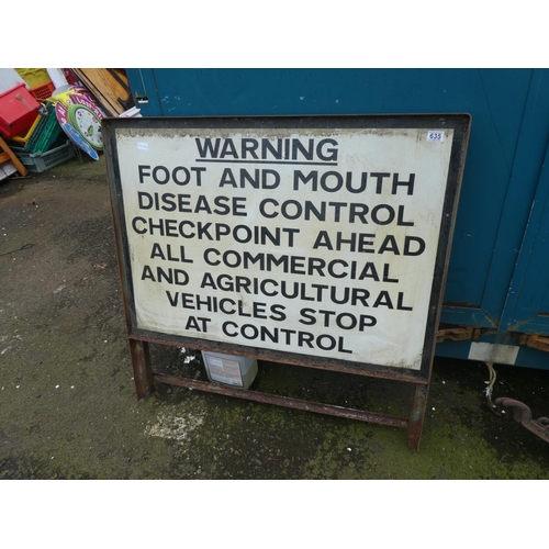 635 - A large warning road sign 'Foot and Mouth Disease Control'.