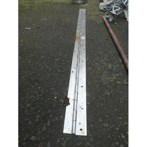 645 - A large stainless steel hinge, measuring 178cm x 10cm.