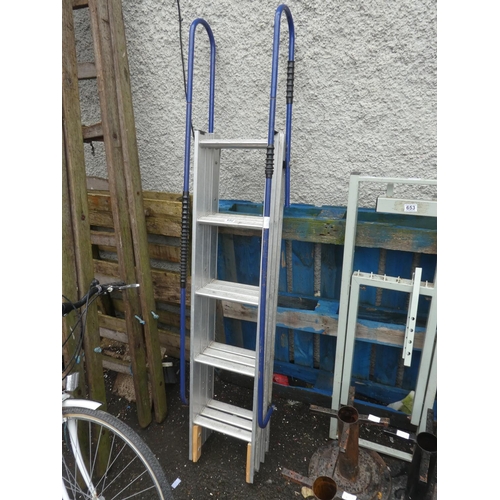 652 - A folding step ladder with handrails.