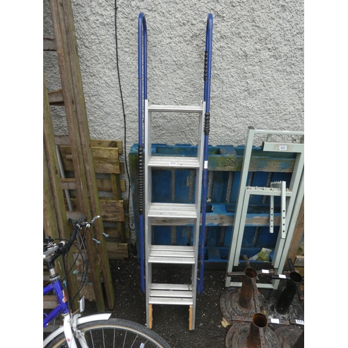 652 - A folding step ladder with handrails.